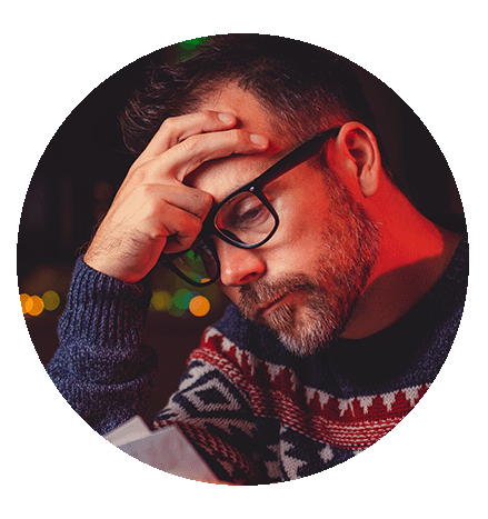 Circular image of a manager wearing a Christmas jumper stressed about seasonal hiring
